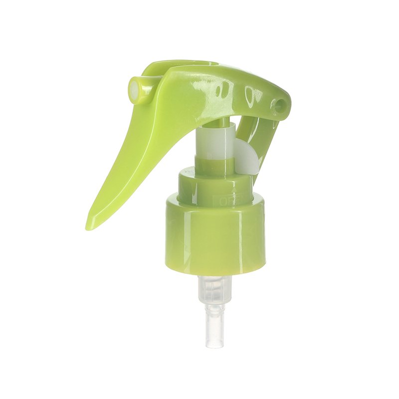 45-degree angled view of green mini trigger sprayer showing nozzle design and lockable button, 24-410 neck, 0.25 ml fine mist spray