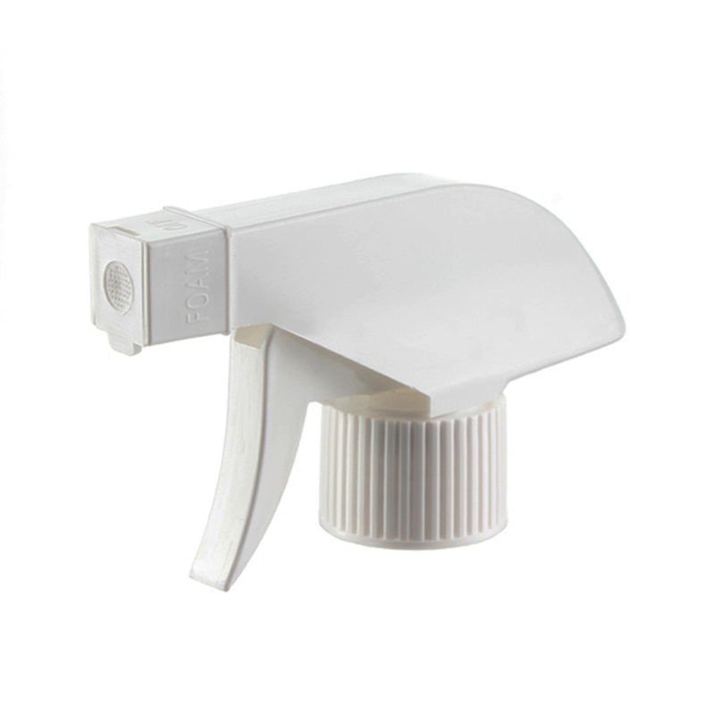 45-degree angled view of white economical foam trigger sprayer showing flip-open mesh nozzle and trigger design, 28-410 neck, 0.6 ml dosage