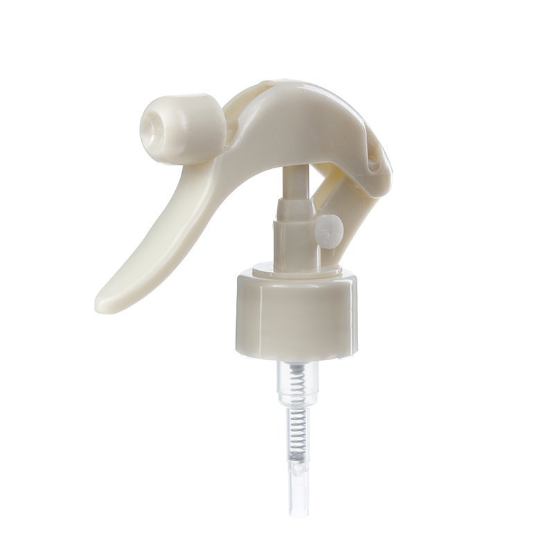 45-degree angled view of pearl white mini trigger sprayer showing nozzle and lockable button, 28-410 neck, fine mist spray, 0.5 ml output