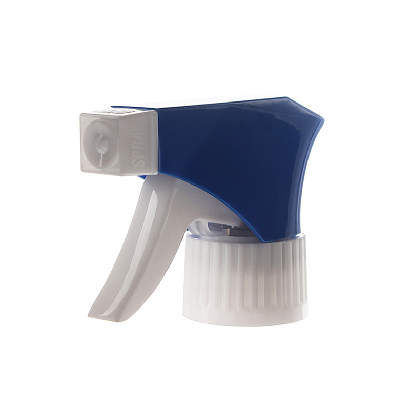 45-degree angled view of blue and white economical trigger sprayer showing spray/stream nozzle and short-shroud body, 28-410 neck, 0.6 ml dosage