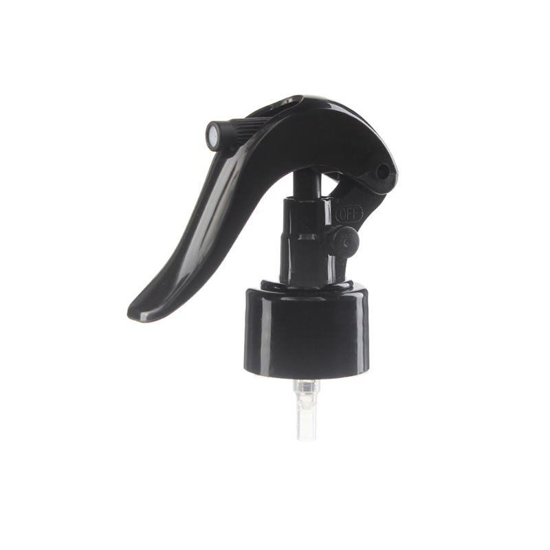 45-degree angled view of black mini trigger sprayer showing nozzle and lockable button, 28-410 neck, fine mist spray, 0.25 ml dosage