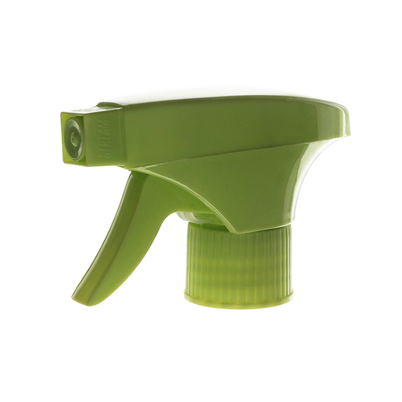 45-degree angled view of green economical trigger sprayer showing spray/stream nozzle and dual-shroud structure, 28-410 neck, 0.6 ml dosage