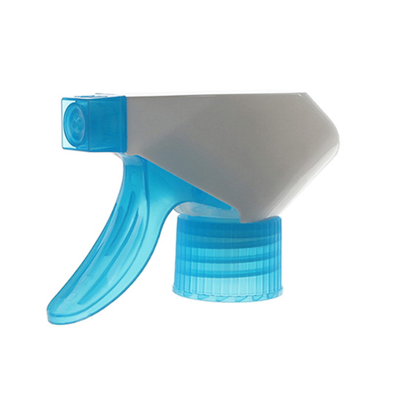 45-degree angled view of translucent blue and white economical trigger sprayer showing spray/stream nozzle and short-shroud structure, 28-410 neck, 0.6 ml dosage