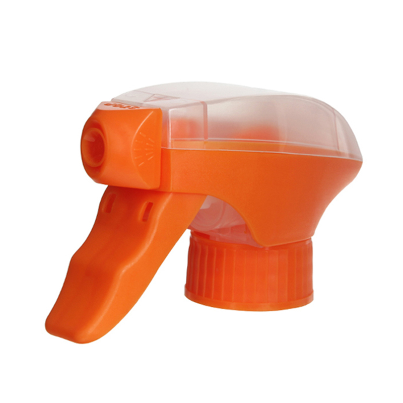 45-degree angled view of orange and clear all-plastic trigger sprayer showing spray/stream nozzle and dual-shroud structure, 28-410 neck, 1.2 ml dosage