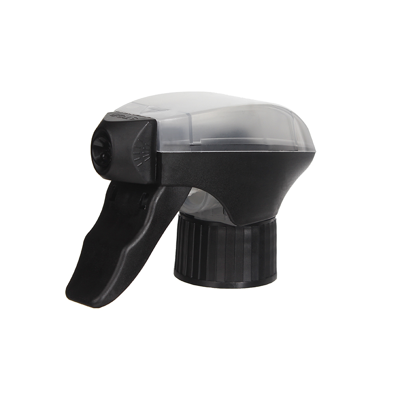 45-degree angled view of black and clear all-plastic trigger sprayer showing spray/stream nozzle and dual-shroud construction, 28-410 neck, 1.2 ml dosage