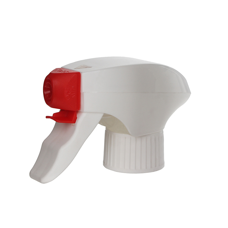45-degree angled view of red and white child-resistant trigger sprayer showing dual-shroud body and spray/stream nozzle, all-plastic design, 28-410 neck, 1.2 ml dosage
