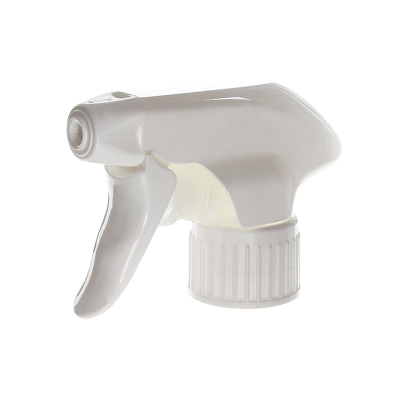 45-degree angled view of white all-plastic trigger sprayer showing spray/stream nozzle and ergonomic trigger design, 28-410 neck, 1.2 ml dosage