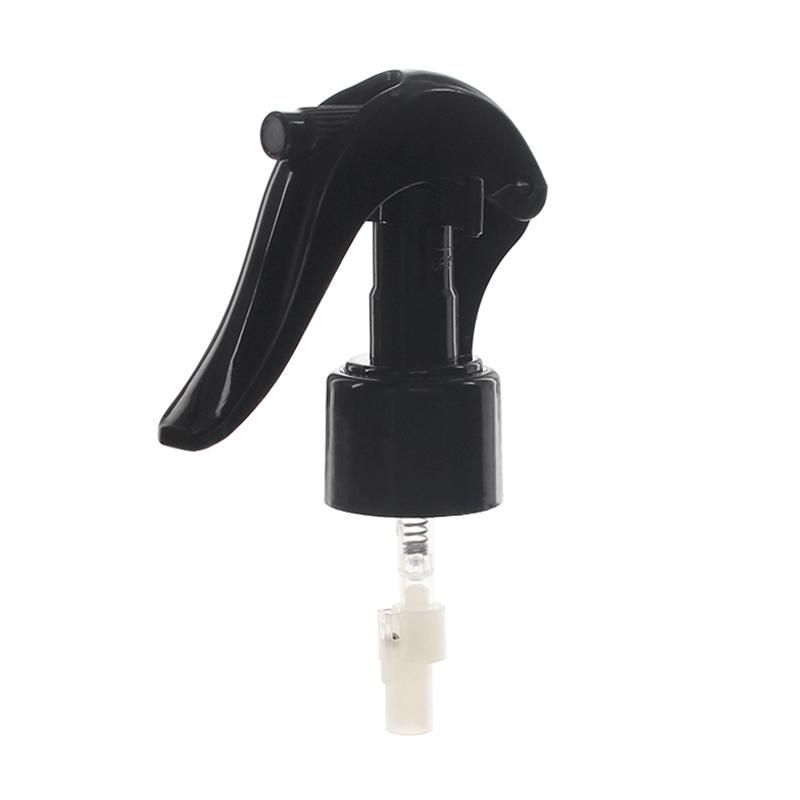 45-degree angled view of black upside down mini trigger sprayer showing nozzle, lockable button, and 24-410 neck for 360-degree fine mist spray, 0.25 ml output