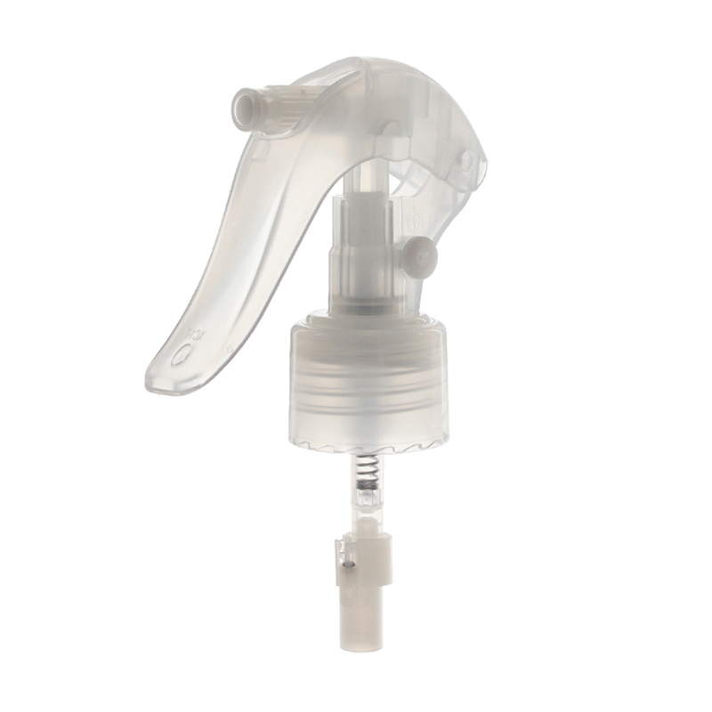 45-degree angled view of clear upside down mini trigger sprayer showing nozzle and lockable button, 24-410 neck, 360-degree fine mist spray, 0.25 ml output