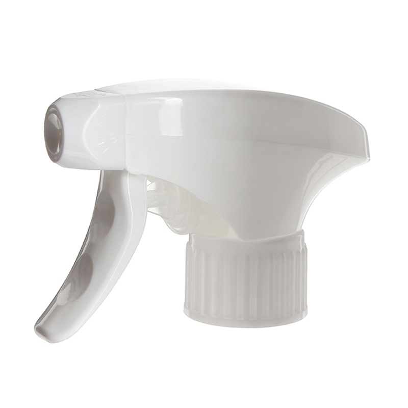45-degree angled view of white metal-free trigger sprayer showing switchable spray/stream nozzle and dual-shroud structure, 28-410 neck, 1.2 ml dosage