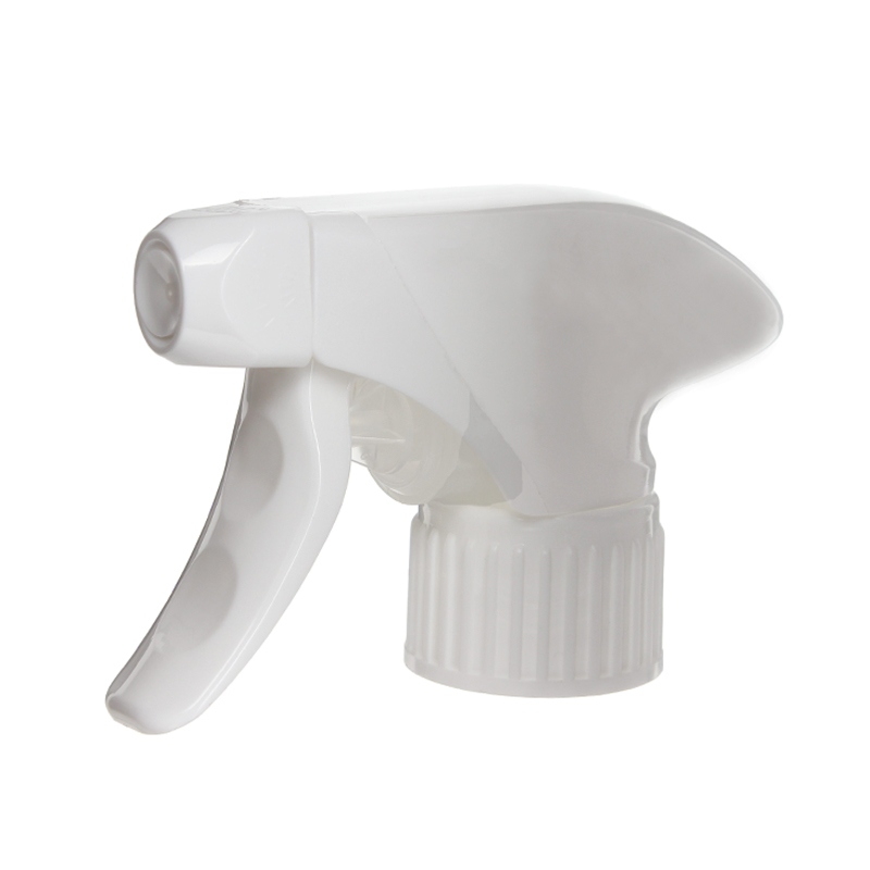 45-degree angled view of white full-plastic trigger sprayer showing spray/stream nozzle and trigger mechanism, 28-410 neck, 1.2 ml dosage